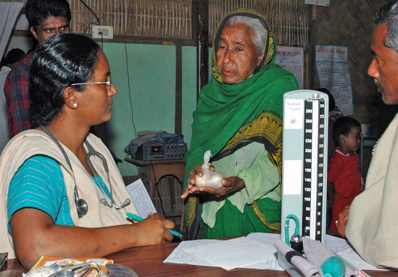 Dr. Ann Miriam with a patient who could only afford eggs as payment. Many rural hospitals in poor communities operate as nonprofits. Photo by Makunda Hospital.