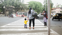 A mother and a toddler cross a road in Pune. Photo by Ameya Mahale/WRI India. 