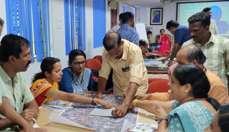 Participants overlay maps to assess vulnerability.