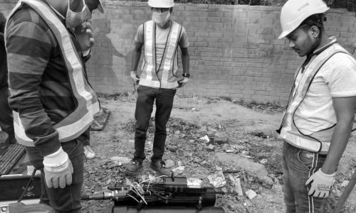 Fluid Robotics employees with robot during deployment