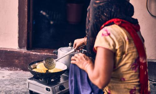 Even if a rural household cooks one or two of its daily meals in electric/induction cookstoves, it helps bring down indoor emissions. Photo by Ashwini Chaudhary/Unsplash.