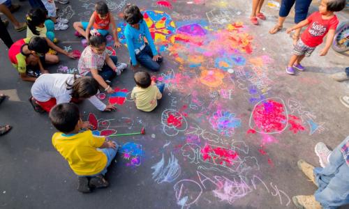 Children painting on the streets in Kolkata, India. Photo by Rudra Narayan Mitra/Shutterstock.