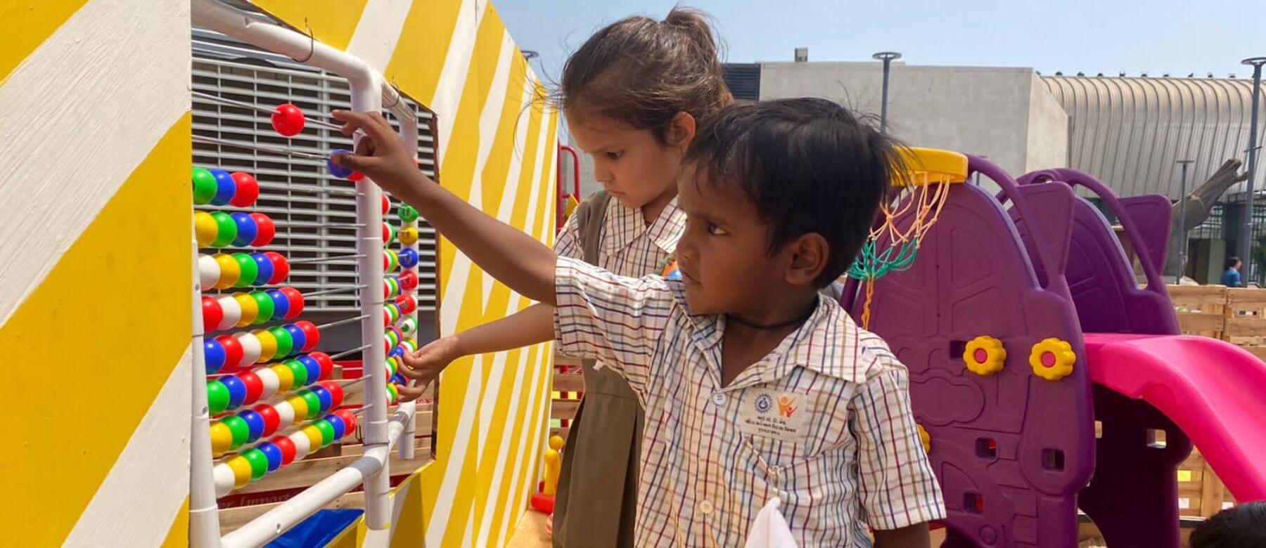 child plays with a play installation at the exhibition